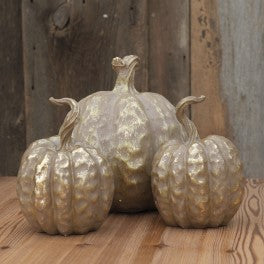 An image of some gold pumpkins